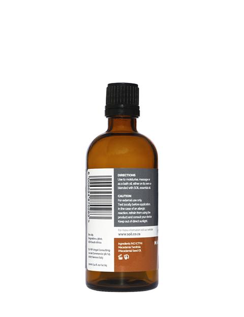 A 100ml bottle of Organic Macadamia Nut Oil, showcasing its elegant design and purity, ideal for skincare and massage.