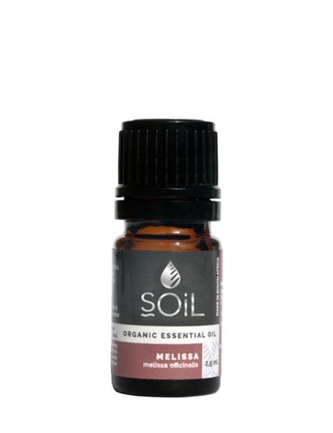 A 2.5ml bottle of Organic Melissa Essential Oil with a lemon balm plant in the background, showcasing its natural and organic qualities.