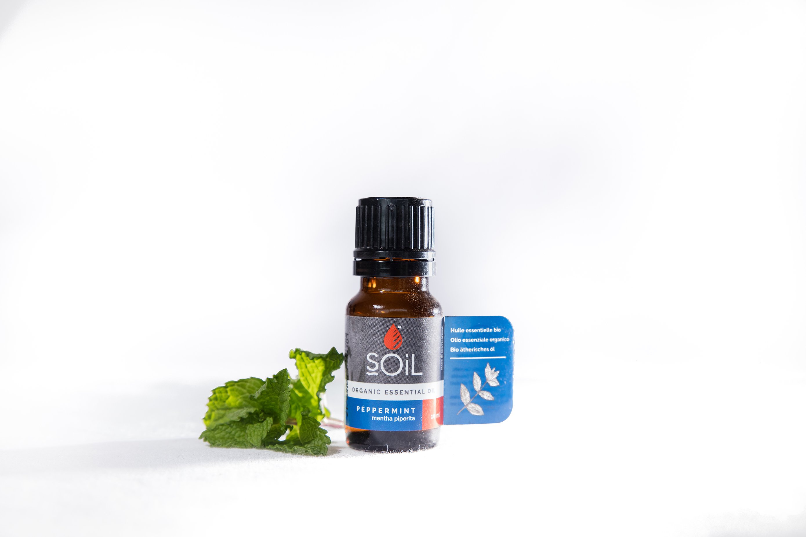 A 10ml bottle of Organic Peppermint Essential Oil (Mentha Piperita) with a refreshing green label, showcasing its purity and organic certification.