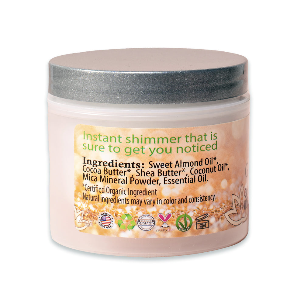 A jar of Organic Shimmering Whipped Body Butter with a creamy texture and shimmering effect, surrounded by natural ingredients.