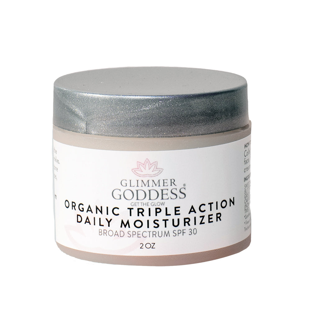 Organic Triple Action Daily Face Cream SPF 30 in a sleek container, showcasing its lightweight texture and natural ingredients.