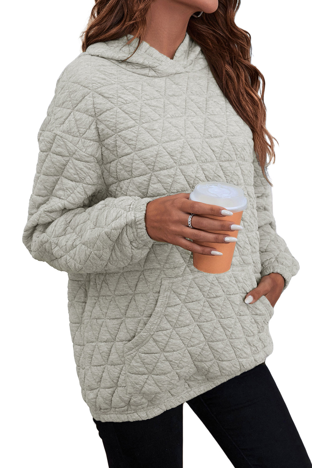 Pale khaki solid color quilted kangaroo pocket hoodie displayed on a mannequin, showcasing its stylish design and functional features.