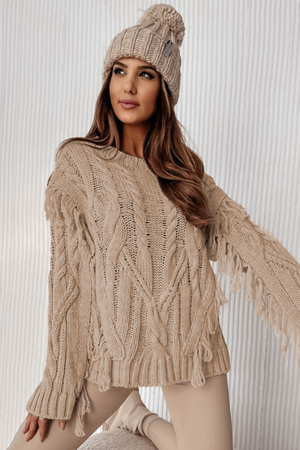 Parchment Tasseled Braided Knit Sweater featuring elegant tassels and braided knit design, perfect for winter fashion.