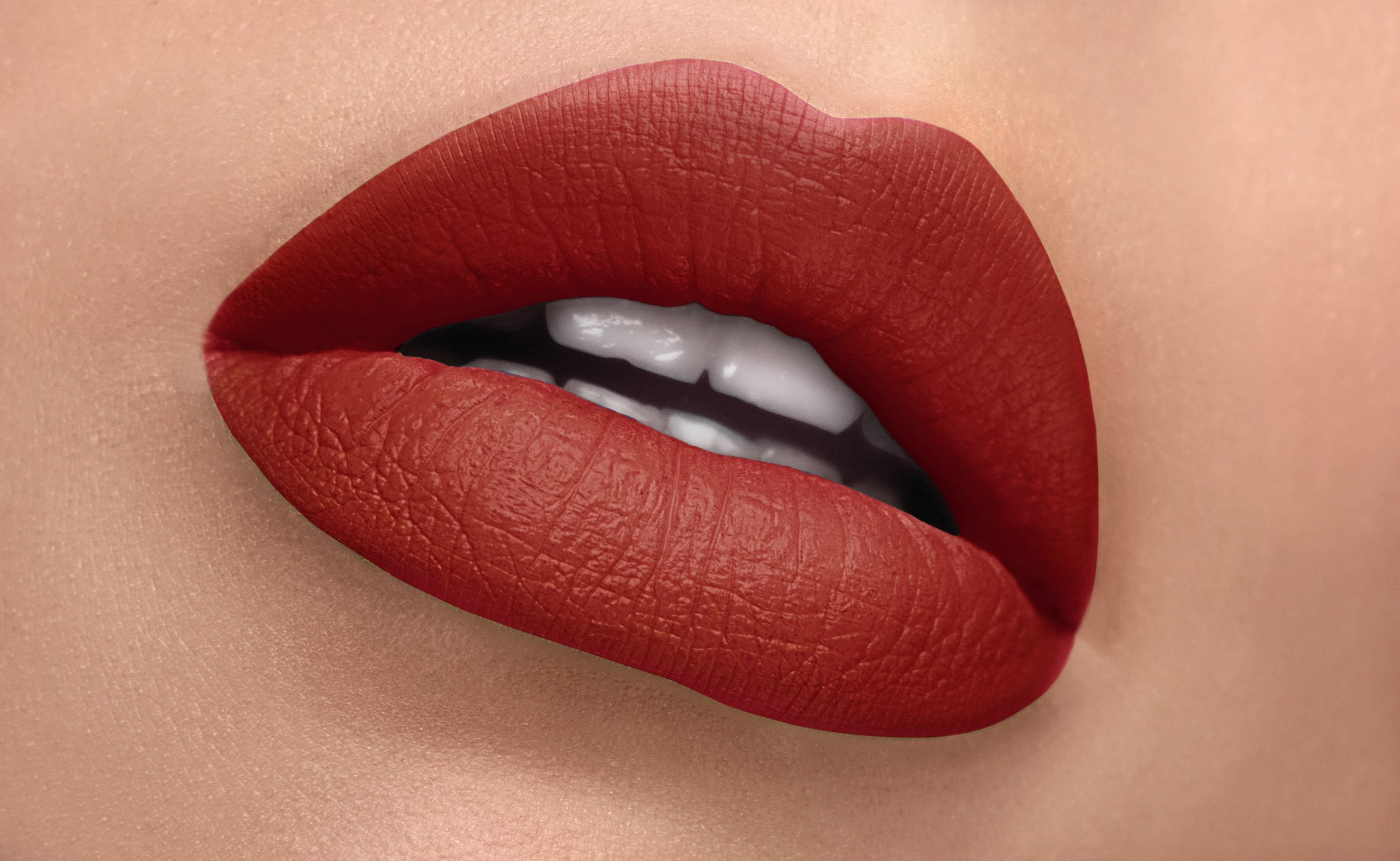 Passion Silk-Matte Lipstick in Deep Red Orange shade, showcasing its sleek design and vibrant color.