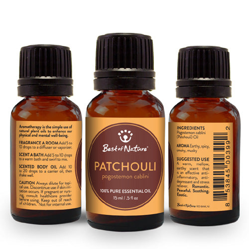 A bottle of 100% pure Patchouli Essential Oil with a dark amber color, surrounded by fresh green leaves, symbolizing its natural origins.