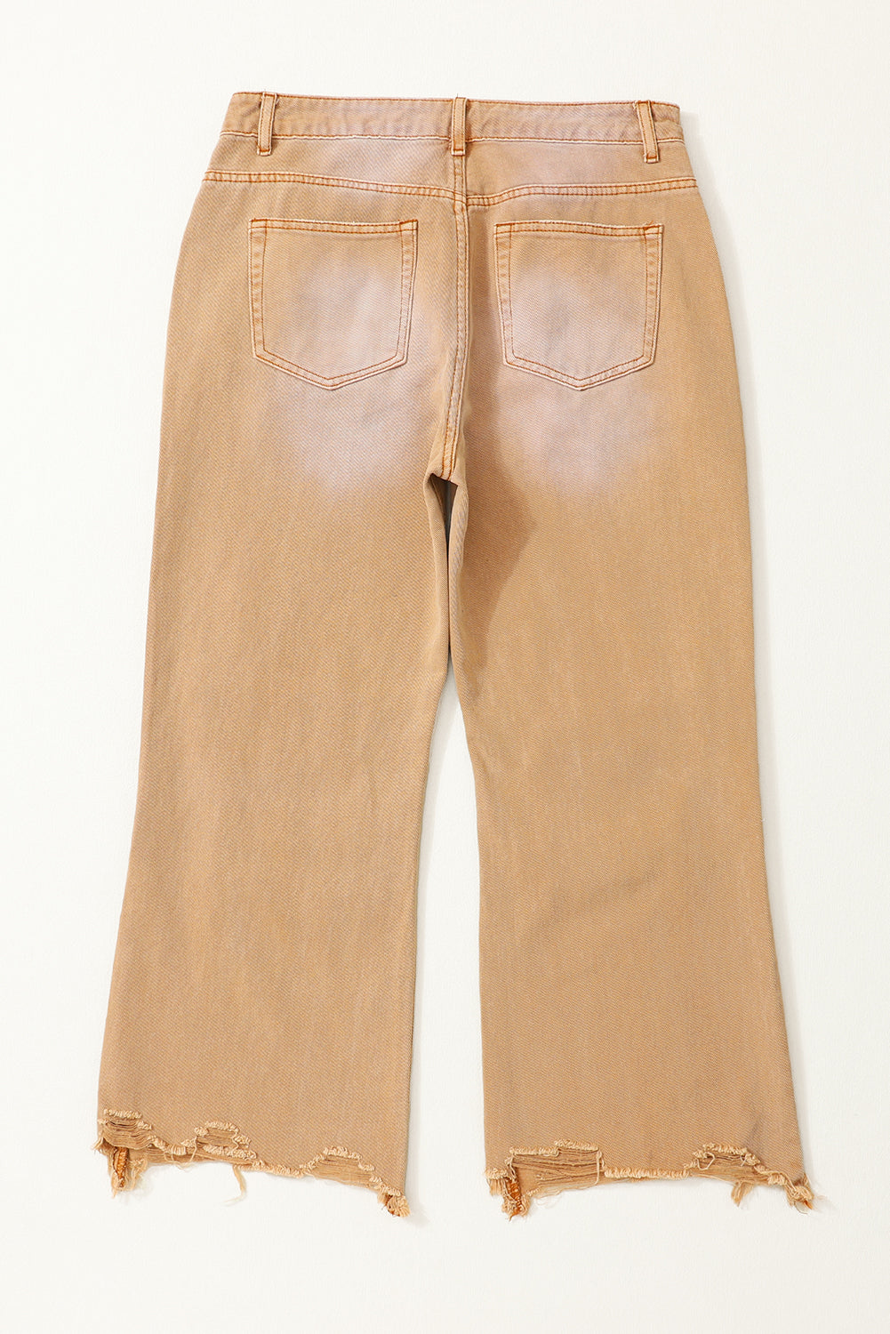 A pair of Peach Blossom Distressed Hollow-out High Waist Cropped Flare Jeans showcasing a vintage style with unique distressed details.