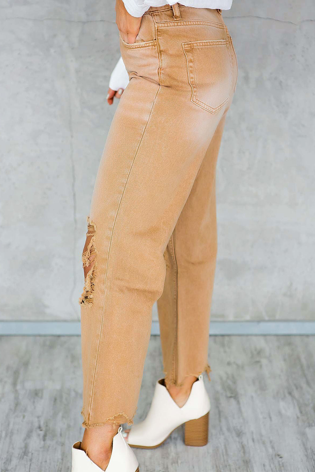 A pair of Peach Blossom Distressed Hollow-out High Waist Cropped Flare Jeans showcasing a vintage style with unique distressed details.