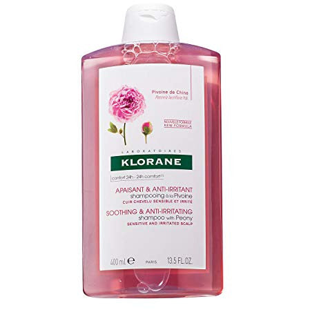 Klorane Peony Soothing & Anti-Irritating Shampoo bottle with floral design, showcasing its calming properties.