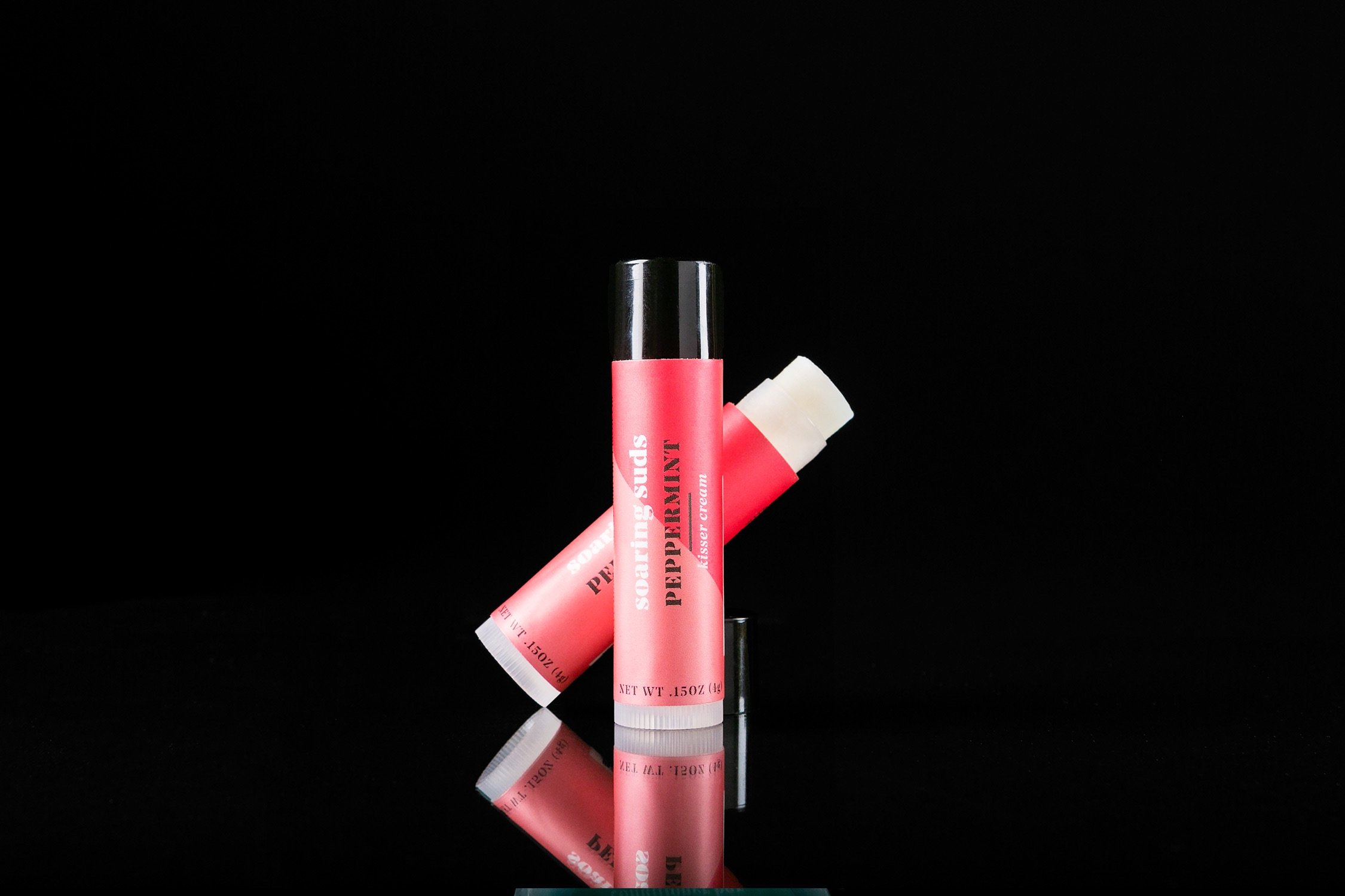 A tube of Peppermint Kisser Cream lip balm with a refreshing peppermint flavor, showcasing its natural ingredients.