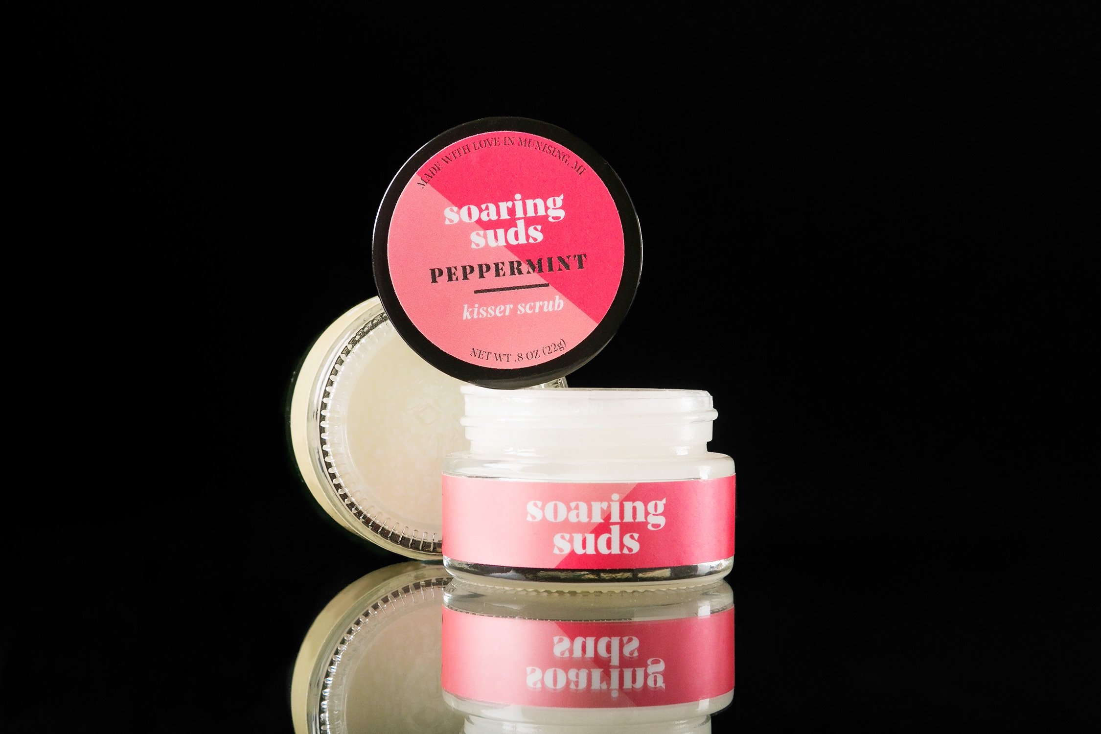 A jar of Peppermint Kisser Scrub with a refreshing minty aroma, showcasing its natural ingredients and smooth texture.