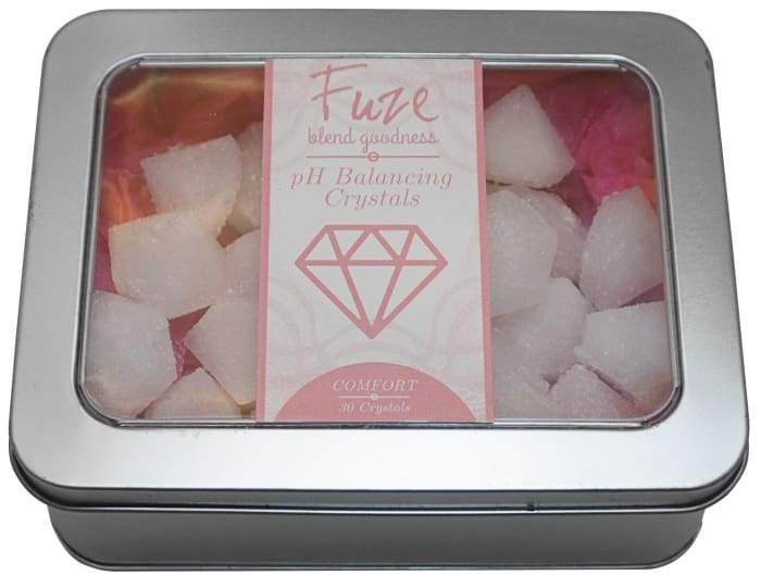 A tin of FuzeBody pH Balancing Bath Crystals with crystals and pH test strips, designed for feminine comfort and skin health.