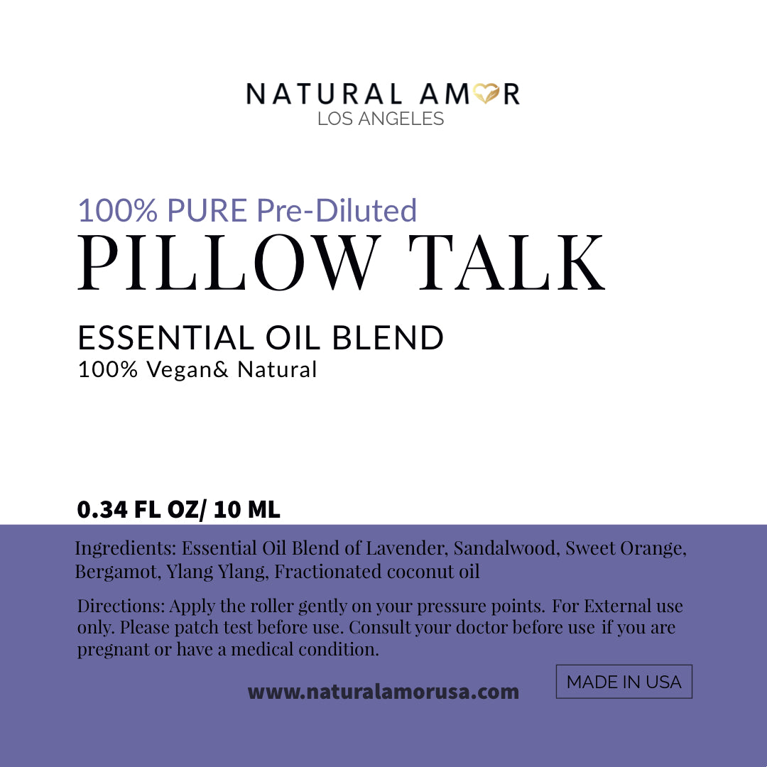 Pillow Talk Roll On Essential Oil Blend in a 10 mL bottle with a stainless steel rollerball, featuring a calming lavender and woodsy design.