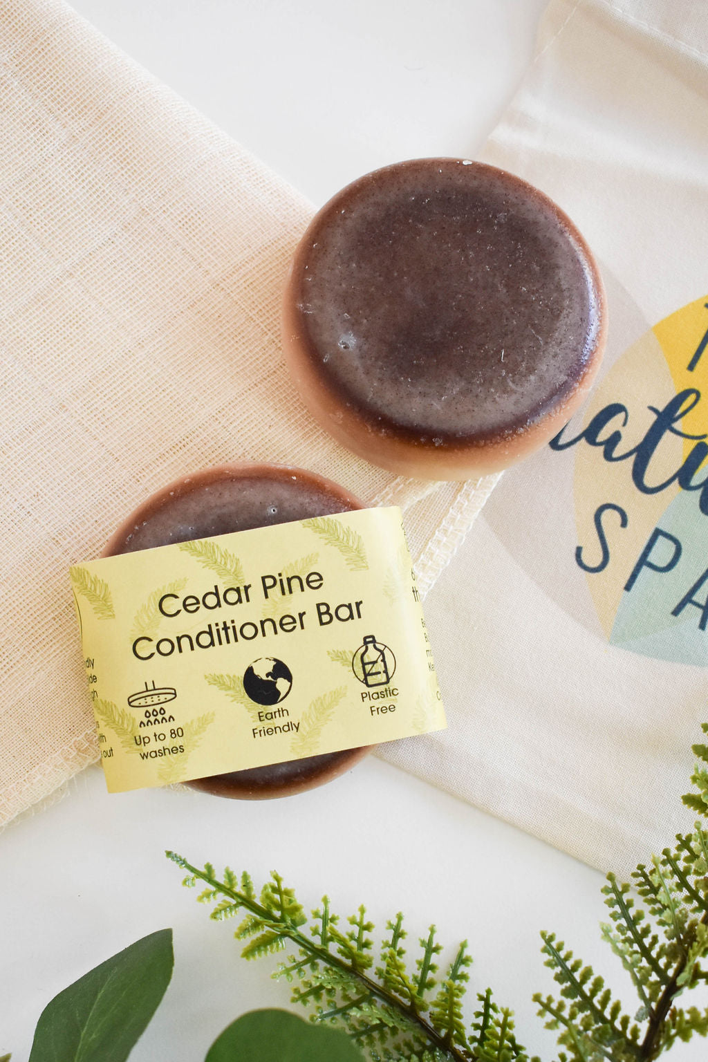 Pine and Cedar Solid Conditioner bar, eco-friendly hair care product, featuring natural ingredients and a unique design.