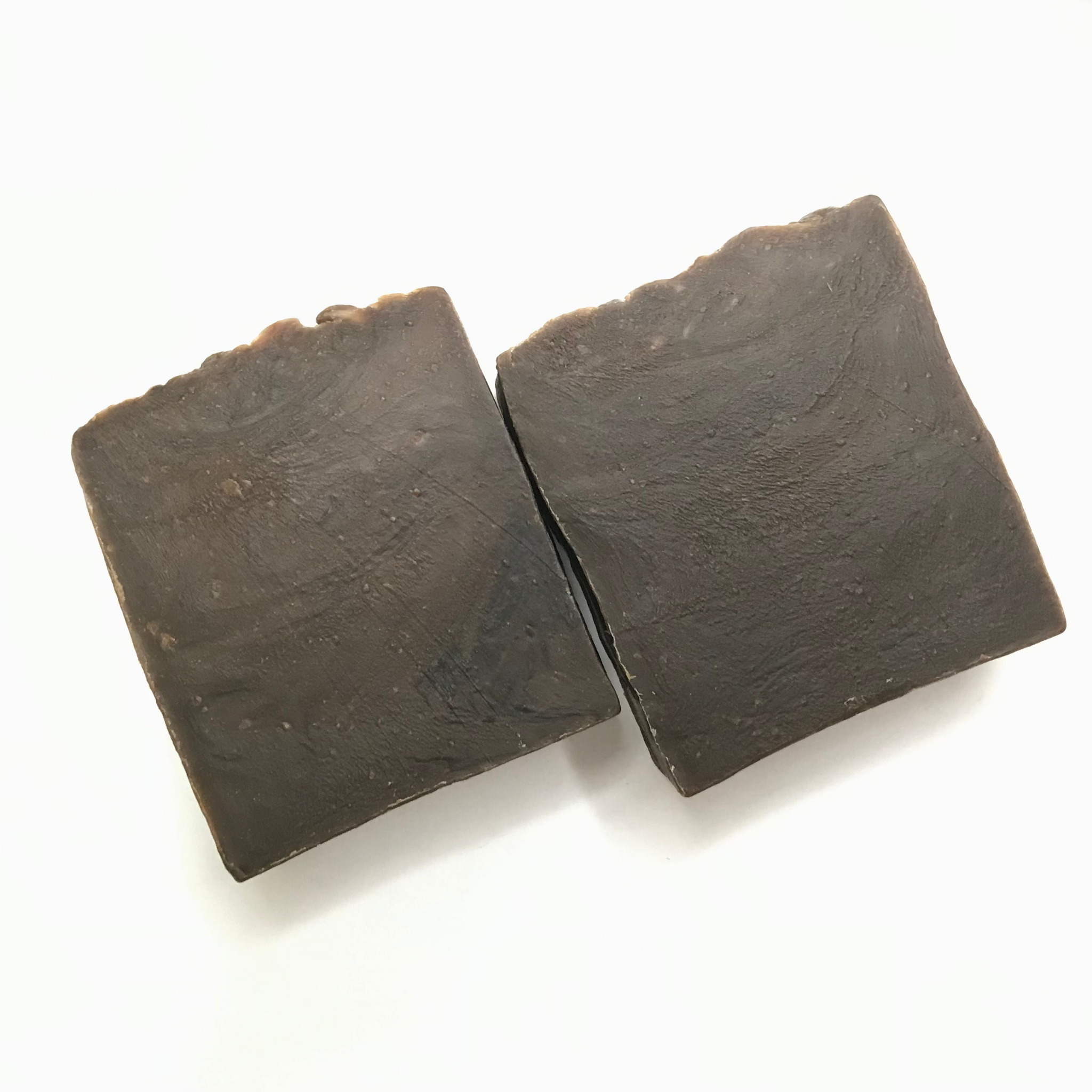 Pine Tar Soap bar with natural ingredients, showcasing its rich texture and earthy color.