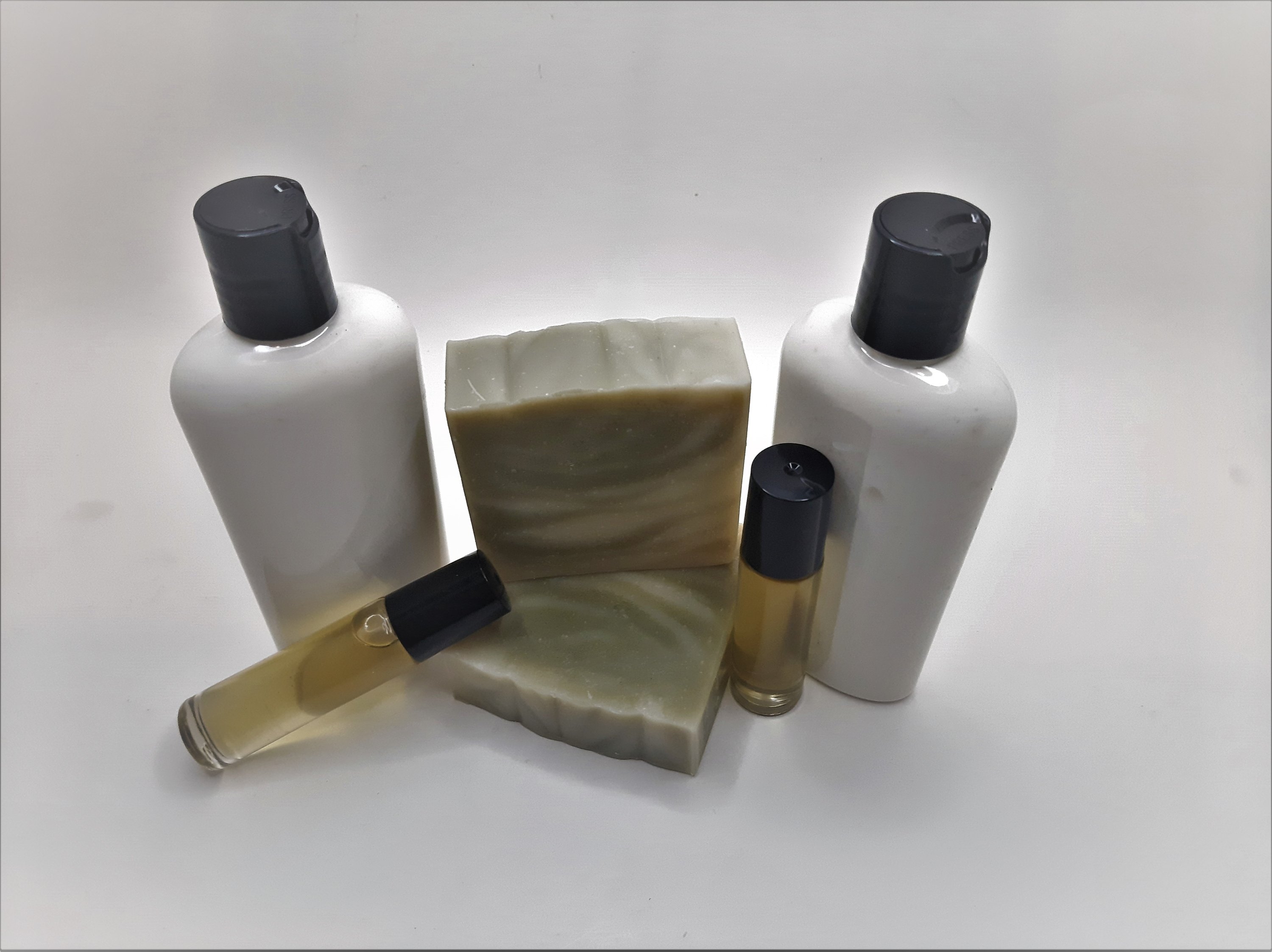 Pine Woods Gift Set featuring handmade soap, lotion, and rollerball with a refreshing pine and citrus scent.