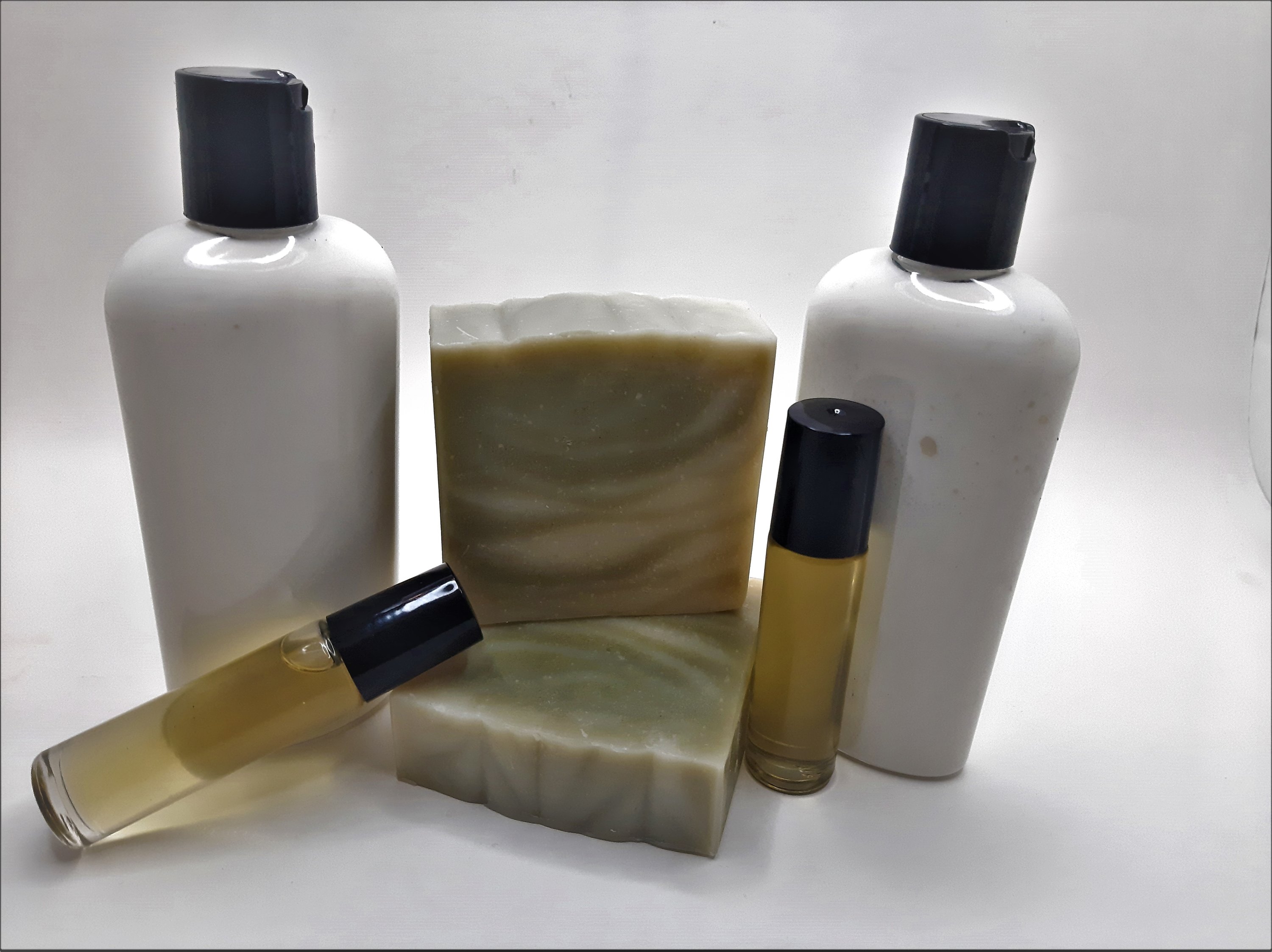 Pine Woods Gift Set featuring handmade soap, lotion, and rollerball with a refreshing pine and citrus scent.