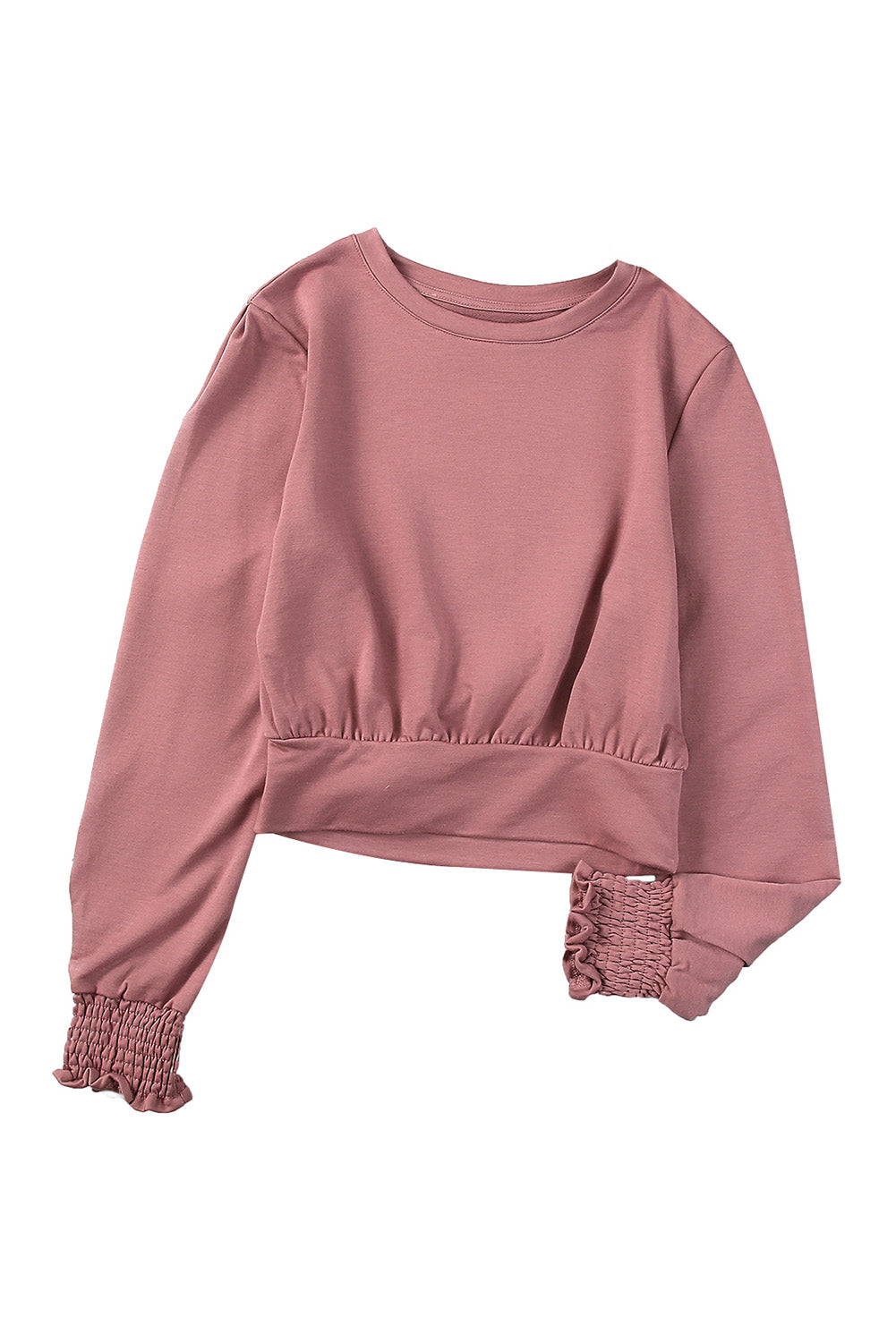 A stylish pink long sleeve crop top with banded hem and smocking cuffs, perfect for casual wear.