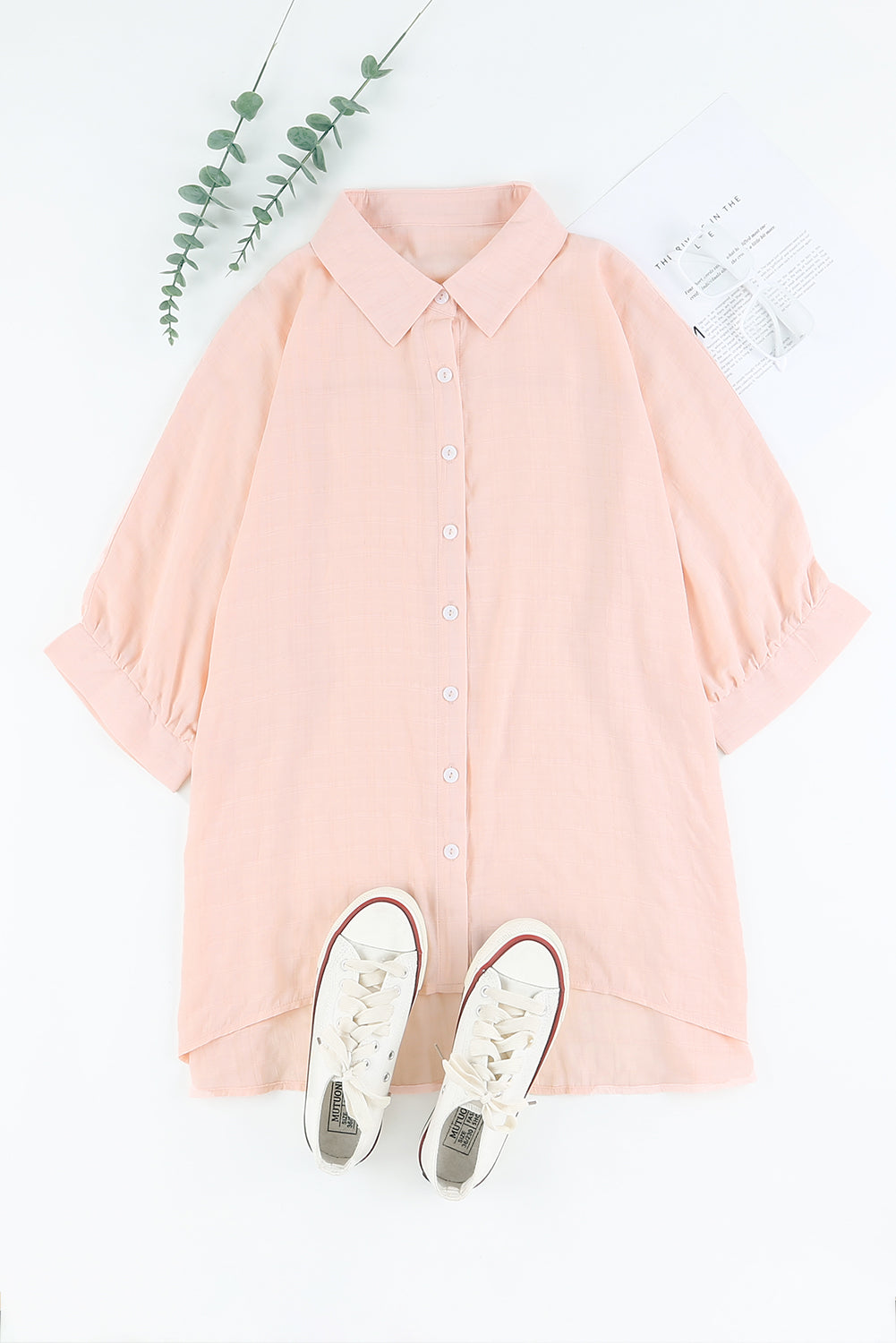 A stylish pink button front shirt with dolman sleeves, showcasing a loose fit and elegant design, perfect for casual or dressy occasions.