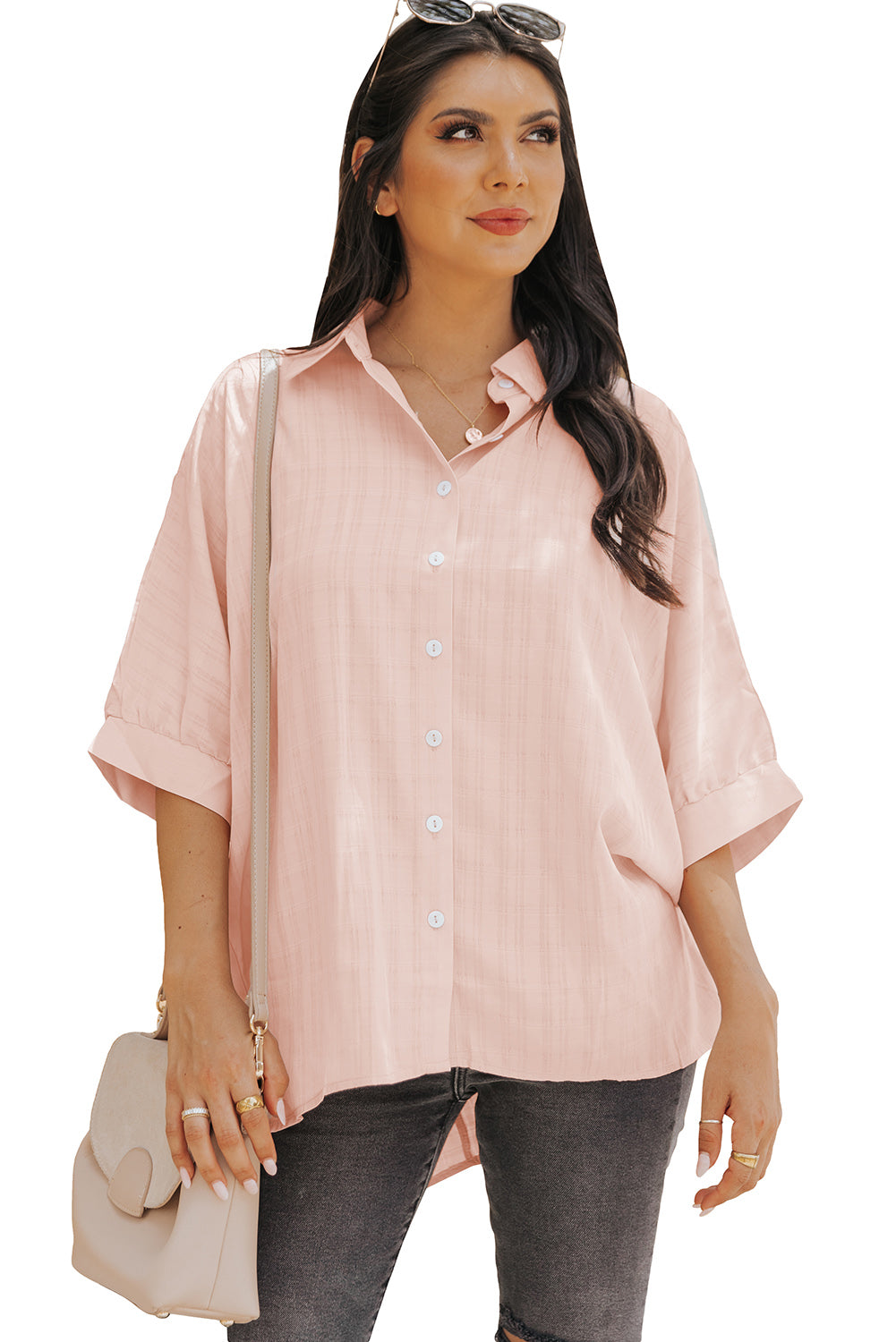 A stylish pink button front shirt with dolman sleeves, showcasing a loose fit and elegant design, perfect for casual or dressy occasions.