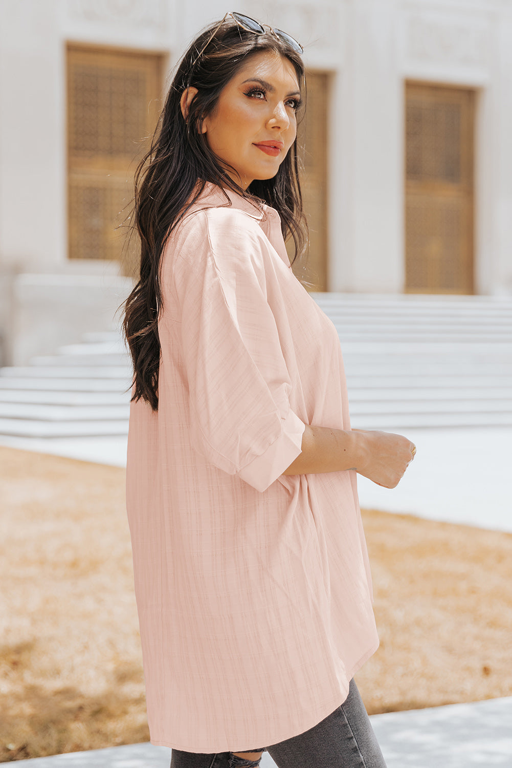 A stylish pink button front shirt with dolman sleeves, showcasing a loose fit and elegant design, perfect for casual or dressy occasions.