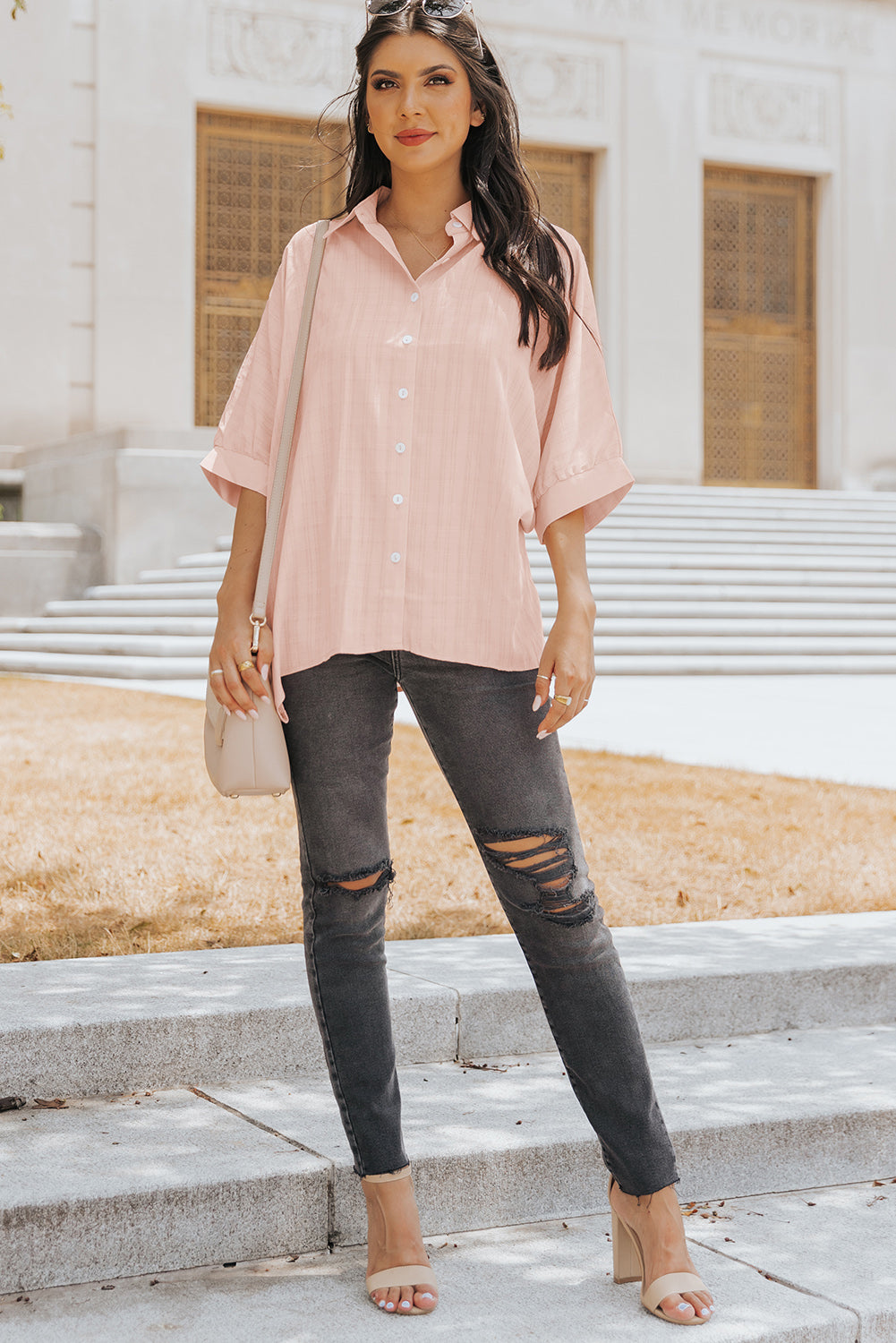 A stylish pink button front shirt with dolman sleeves, showcasing a loose fit and elegant design, perfect for casual or dressy occasions.