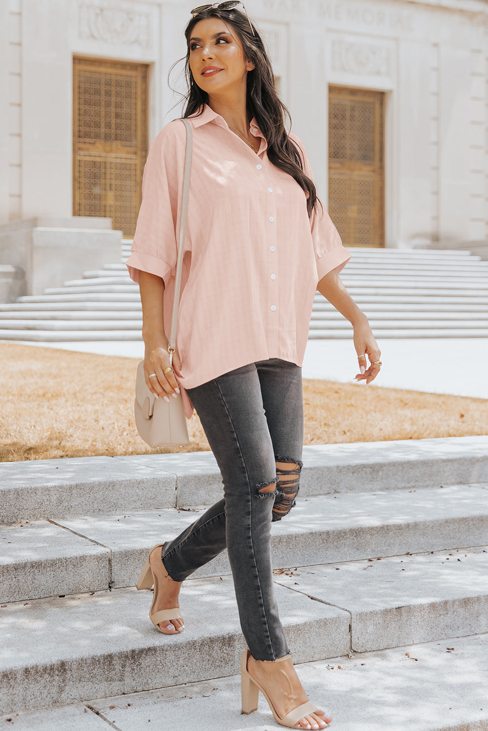 A stylish pink button front shirt with dolman sleeves, showcasing a loose fit and elegant design, perfect for casual or dressy occasions.