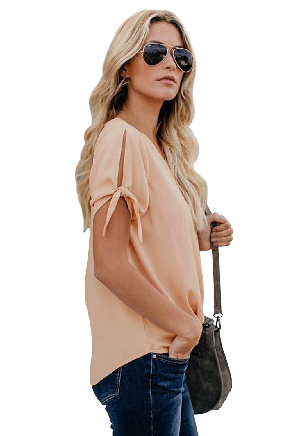 A stylish pink blouse with a v neckline, drape silhouette, rolled hemline, and tie sleeves, perfect for both office and casual wear.