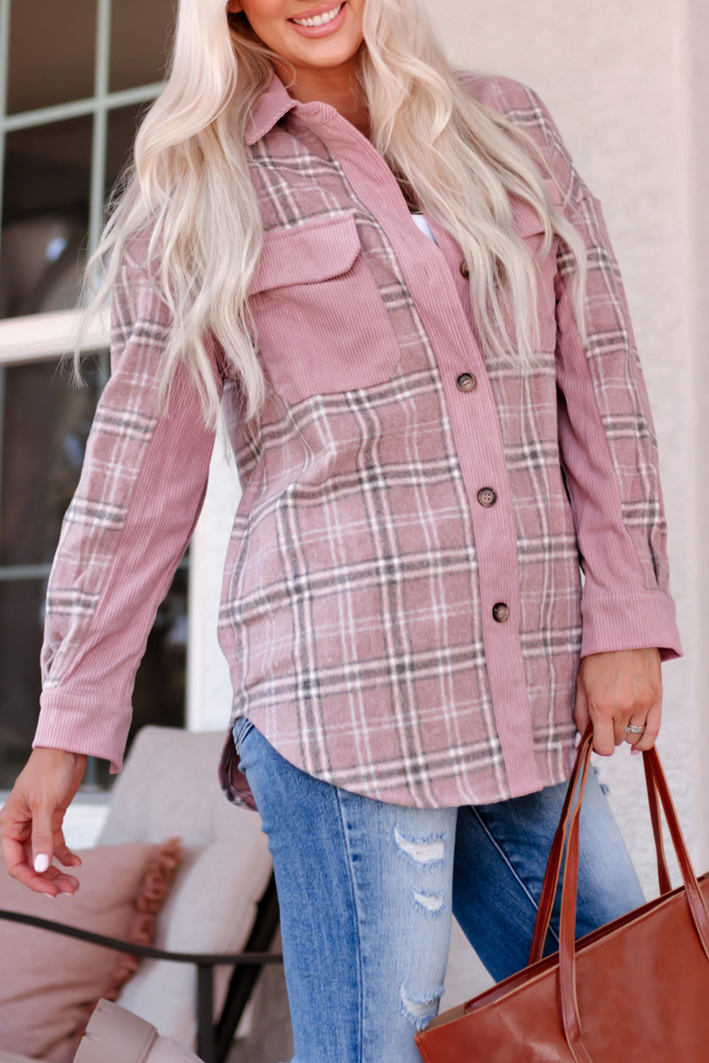 A stylish pink corduroy shacket with plaid pattern, featuring a turn-down collar, chest pockets, and button closure, perfect for casual wear.