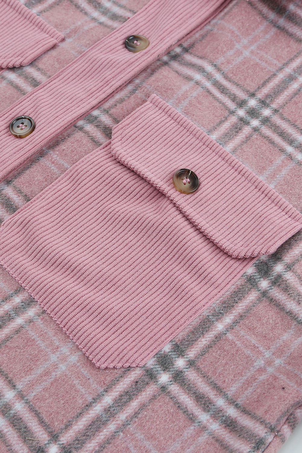 A stylish pink corduroy shacket with plaid pattern, featuring a turn-down collar, chest pockets, and button closure, perfect for casual wear.