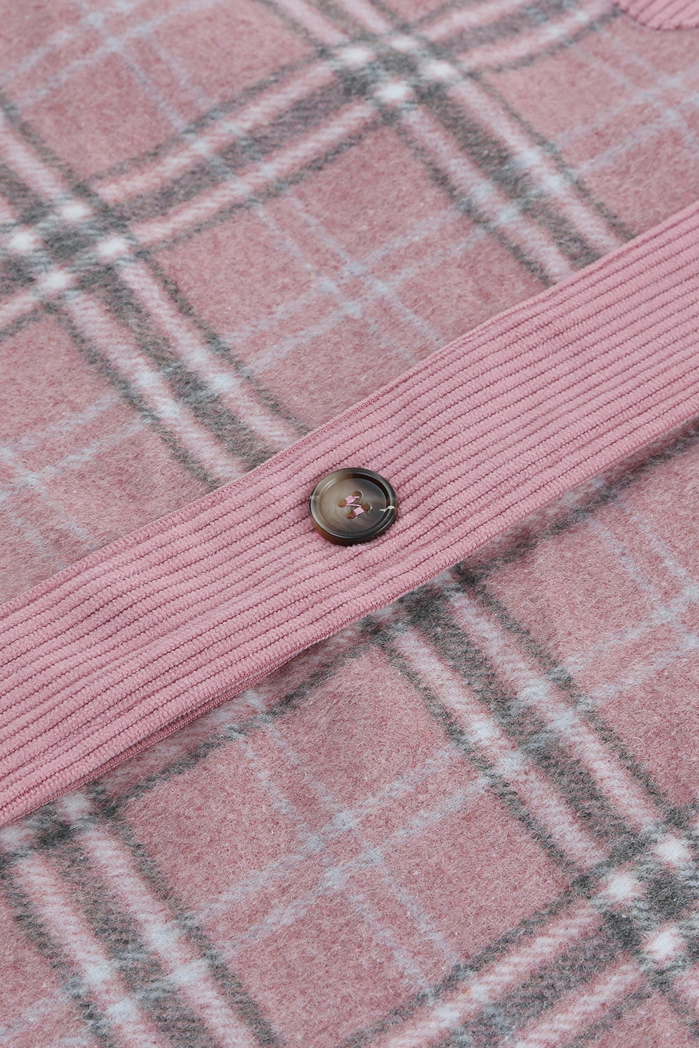 A stylish pink corduroy shacket with plaid pattern, featuring a turn-down collar, chest pockets, and button closure, perfect for casual wear.