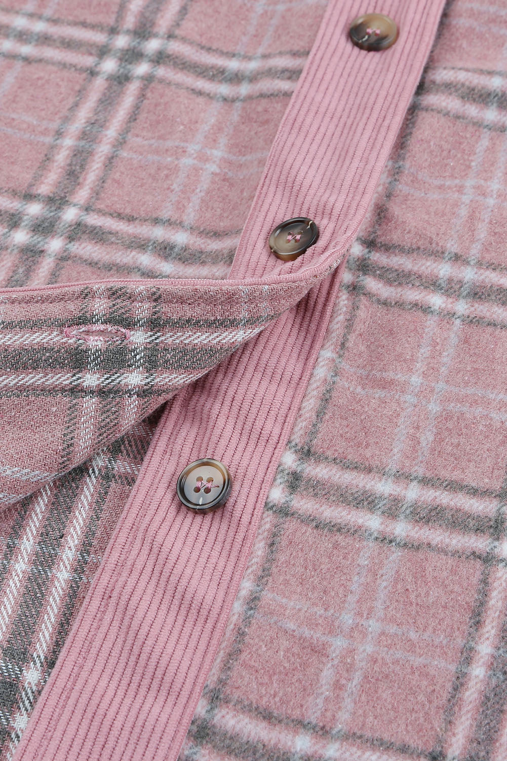 A stylish pink corduroy shacket with plaid pattern, featuring a turn-down collar, chest pockets, and button closure, perfect for casual wear.