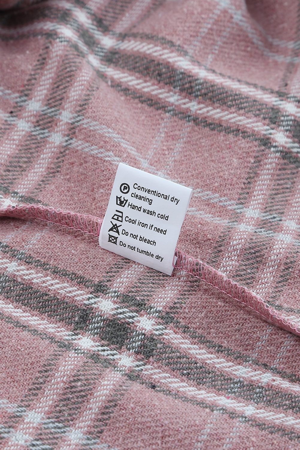 A stylish pink corduroy shacket with plaid pattern, featuring a turn-down collar, chest pockets, and button closure, perfect for casual wear.