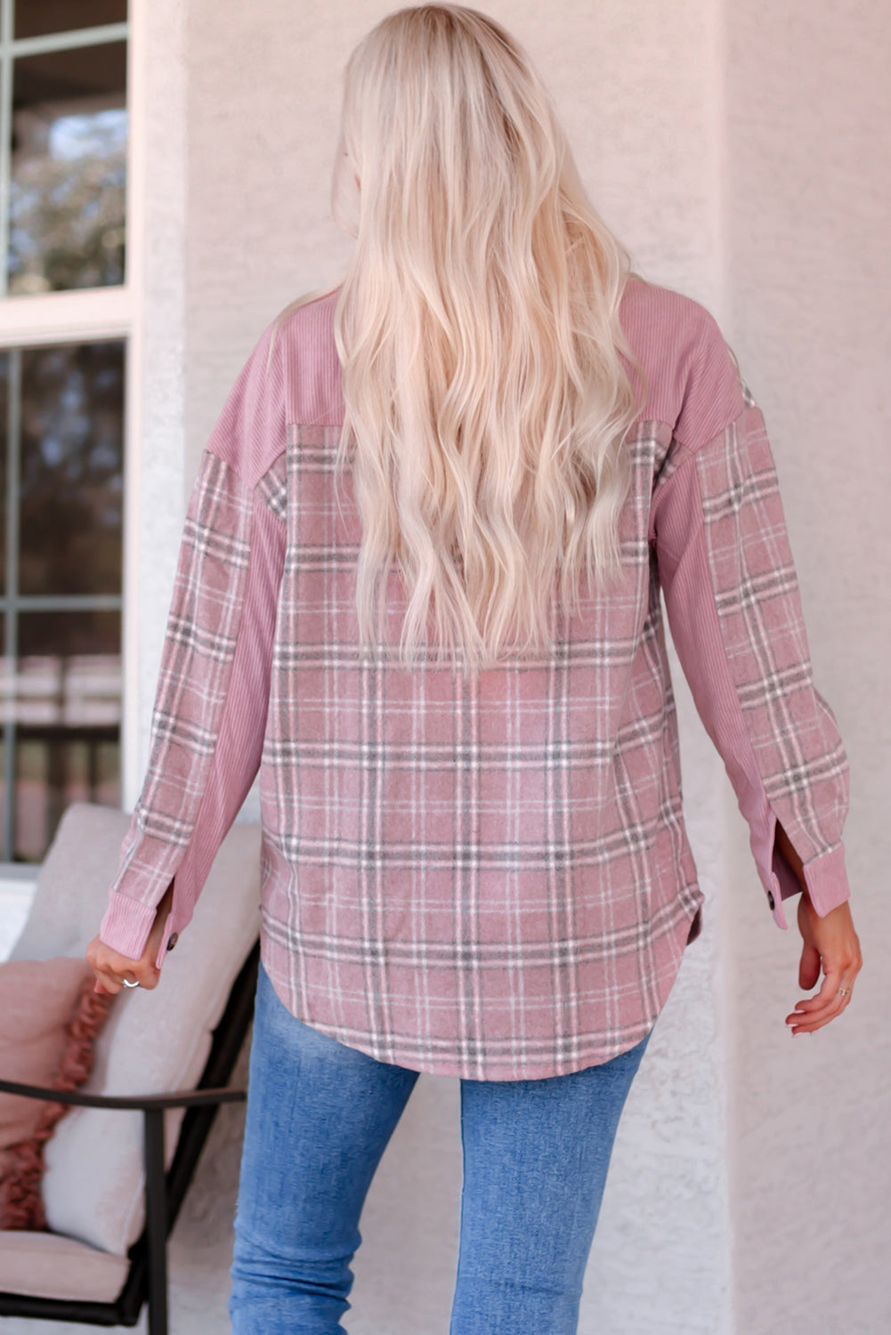 A stylish pink corduroy shacket with plaid pattern, featuring a turn-down collar, chest pockets, and button closure, perfect for casual wear.