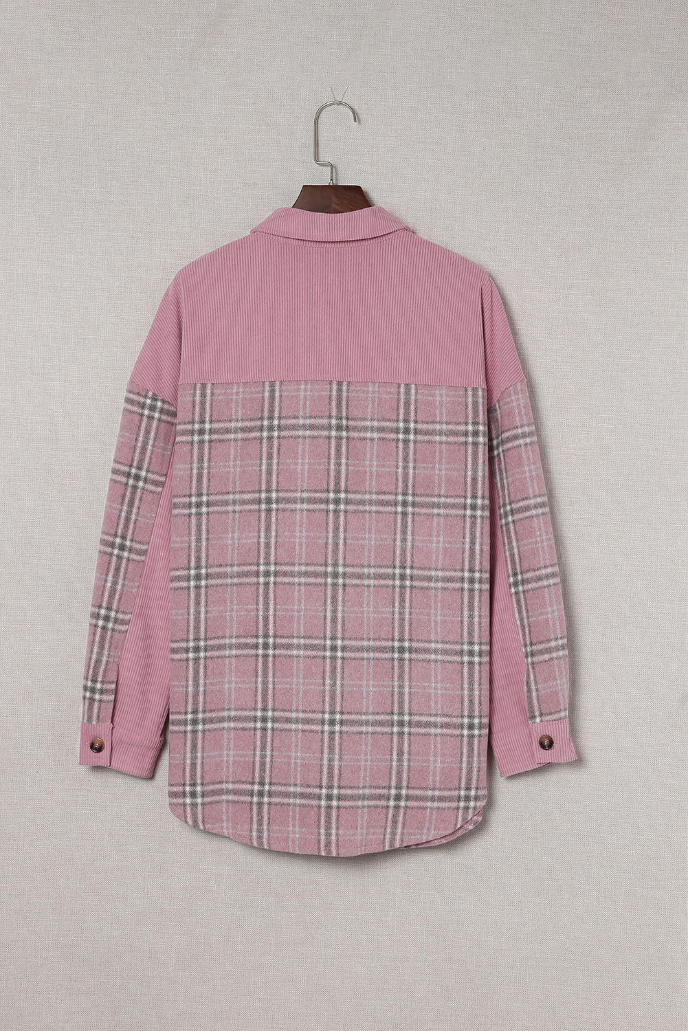 A stylish pink corduroy shacket with plaid pattern, featuring a turn-down collar, chest pockets, and button closure, perfect for casual wear.