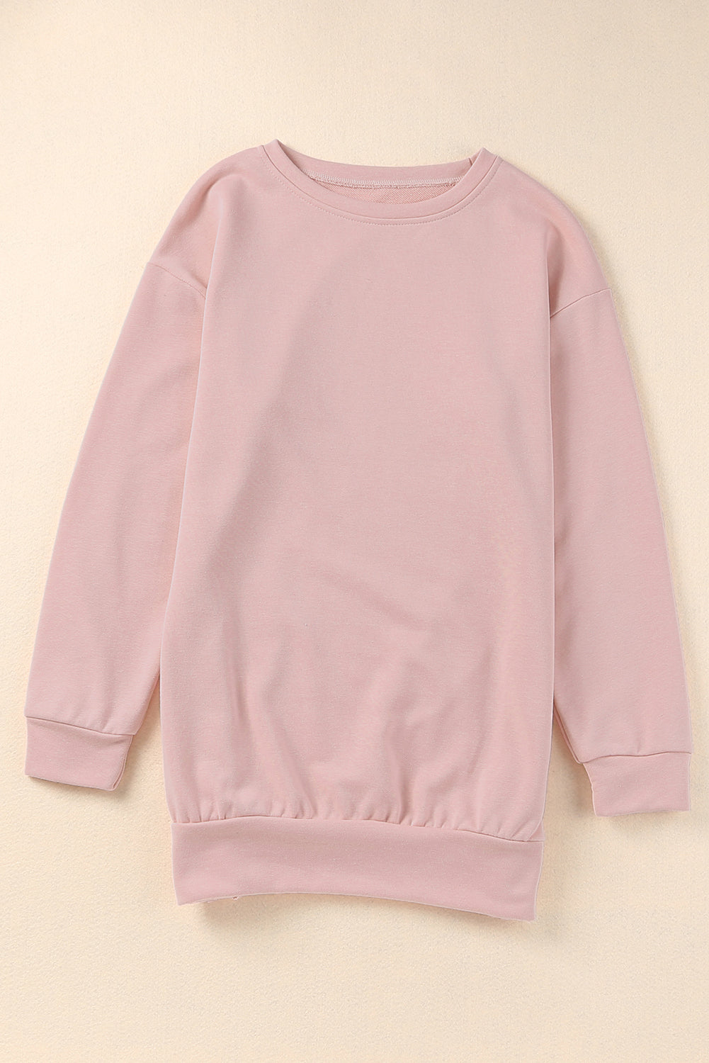 A stylish pink crew neck sweatshirt featuring slit buttons, designed for comfort and a relaxed fit, suitable for all body types.