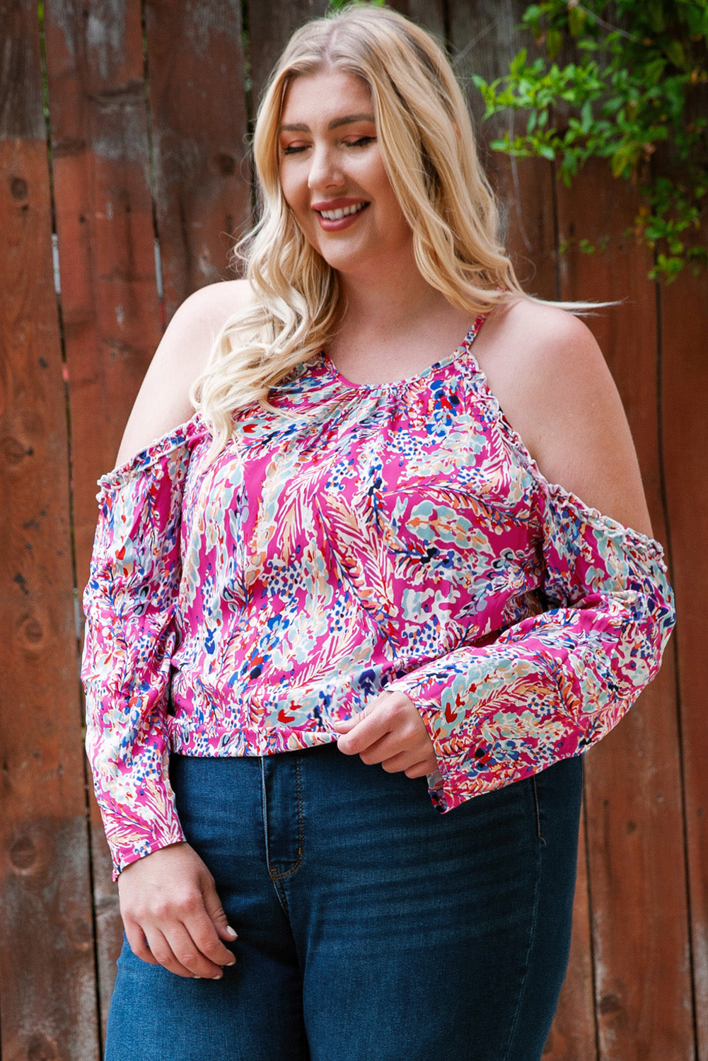 A stylish pink floral print cold shoulder top designed for plus size women, showcasing a vibrant floral pattern and elegant shoulder cutouts.