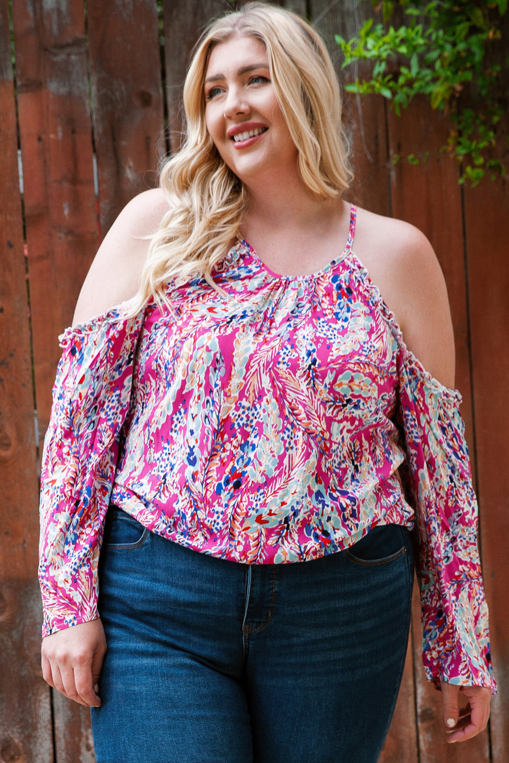 A stylish pink floral print cold shoulder top designed for plus size women, showcasing a vibrant floral pattern and elegant shoulder cutouts.