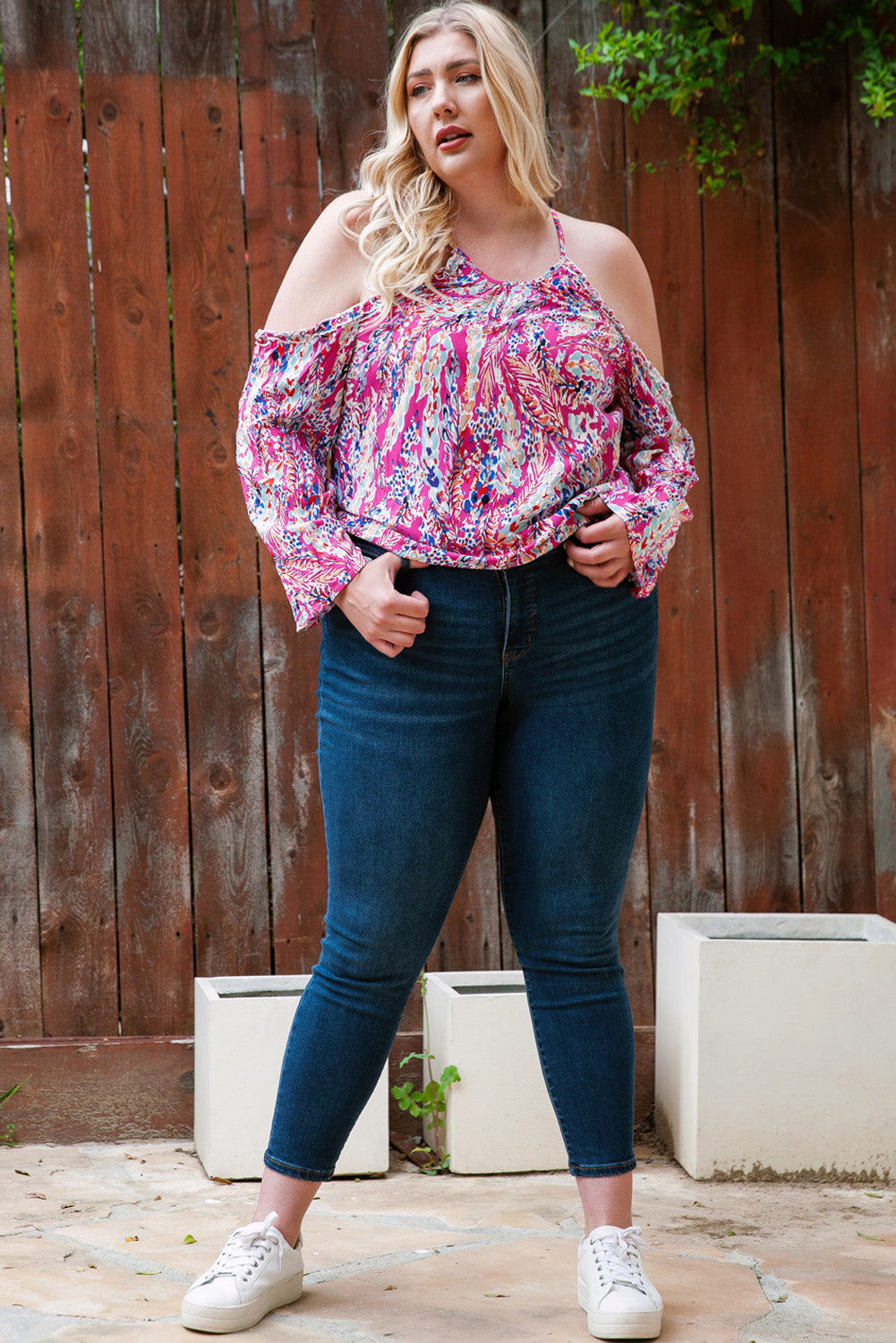 A stylish pink floral print cold shoulder top designed for plus size women, showcasing a vibrant floral pattern and elegant shoulder cutouts.