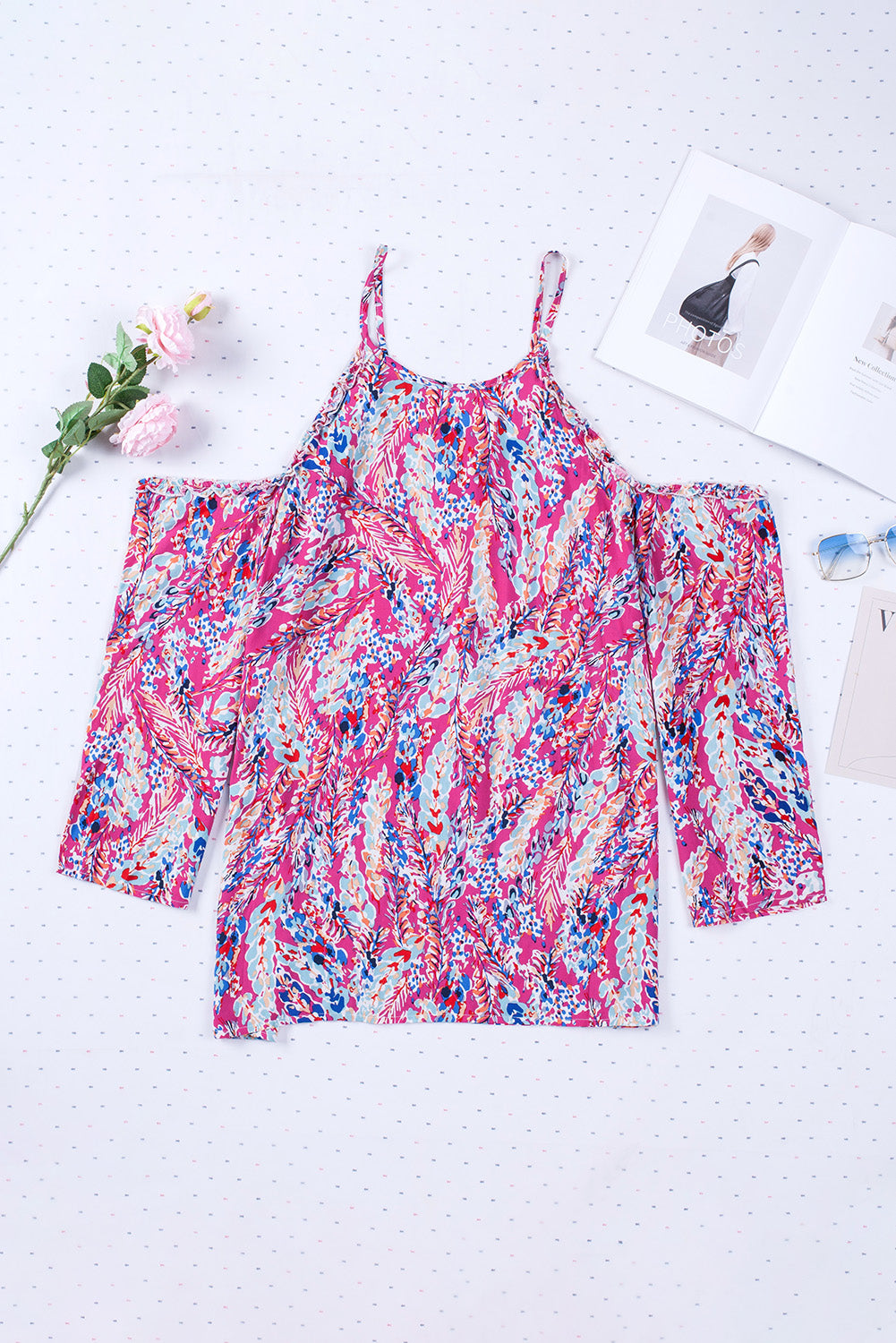 A stylish pink floral print cold shoulder top designed for plus size women, showcasing a vibrant floral pattern and elegant shoulder cutouts.