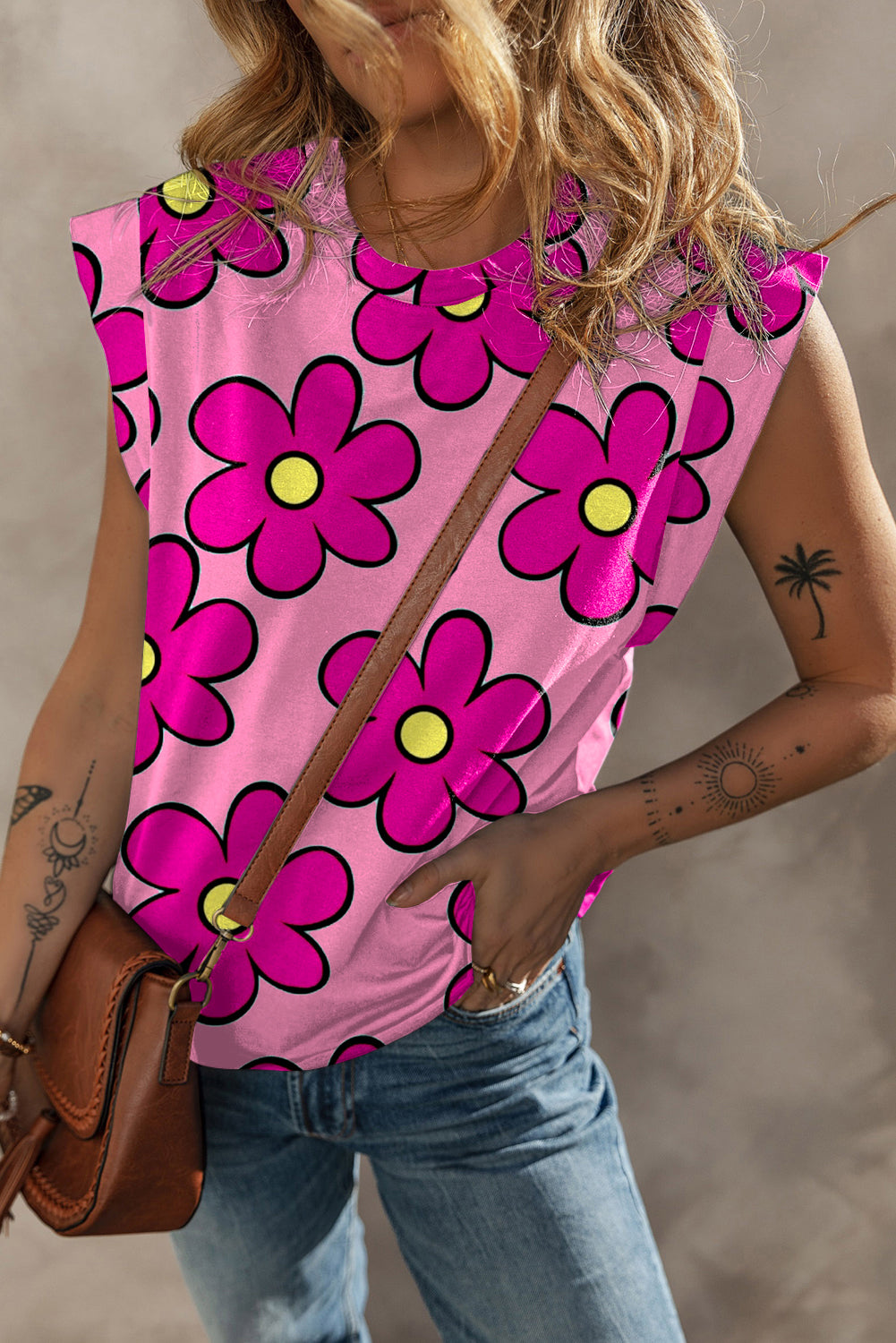 A stylish pink flower print round neck cap sleeve t-shirt displayed on a mannequin, showcasing its vibrant floral design and comfortable fit.