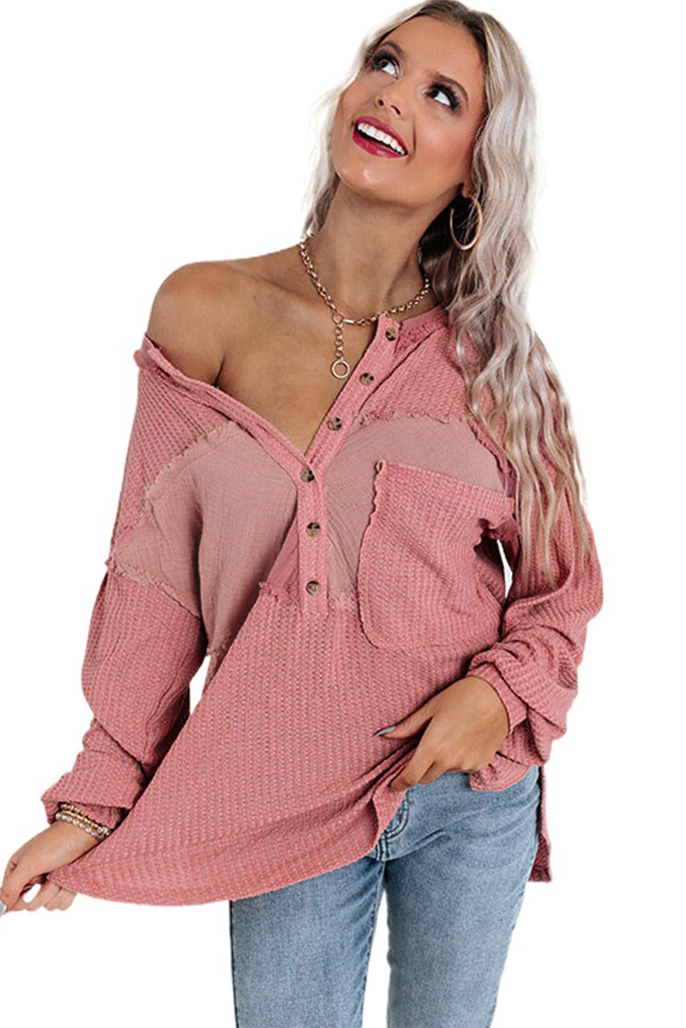 A stylish pink frayed patchwork waffle knit top featuring a buttoned neckline, drop shoulders, and a patch pocket, perfect for casual wear.