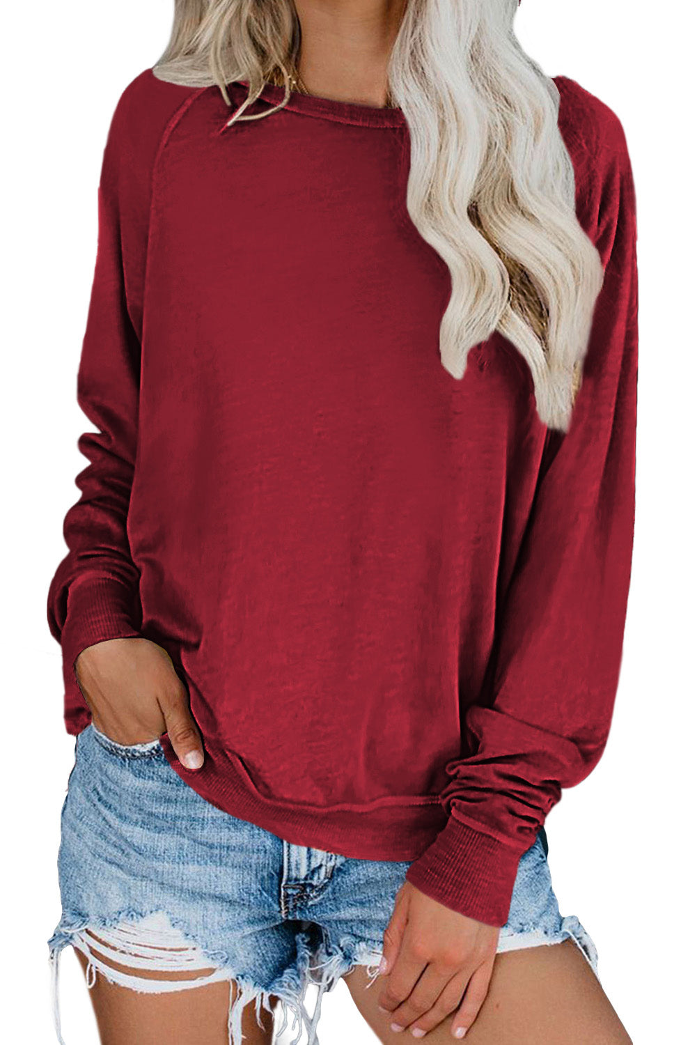 A stylish pink French terry cotton blend pullover sweatshirt featuring a crew neckline, long sleeves, and distressed detailing for a relaxed look.