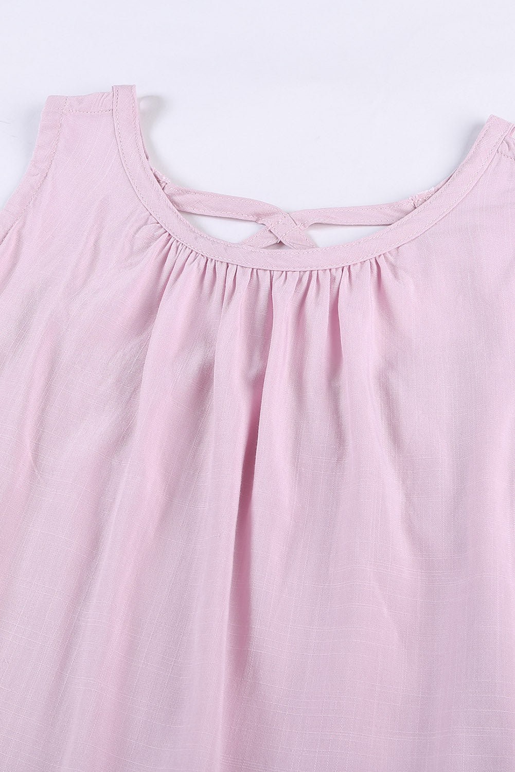 A stylish pink hollow-out tank top showcasing a unique cutout design, perfect for casual and formal occasions.