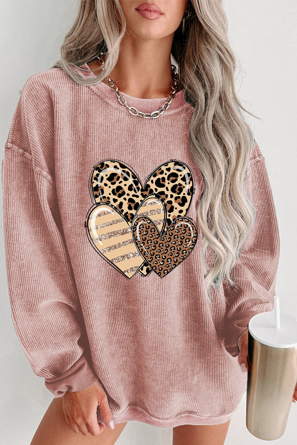 Pink Leopard Heart Shape Corded Loose Fit Sweatshirt displayed on a mannequin, showcasing its trendy design and soft fabric.