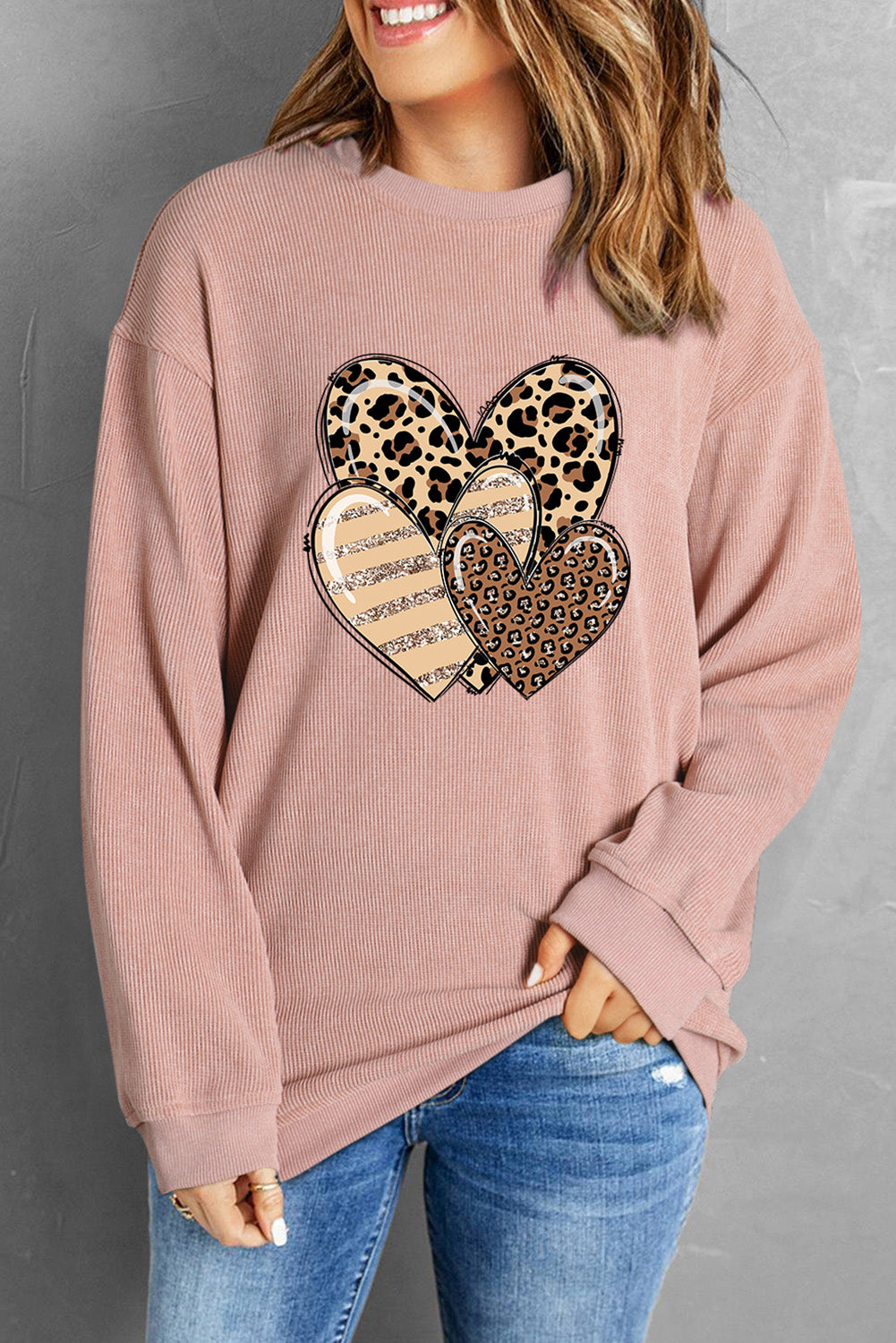 Pink Leopard Heart Shape Corded Loose Fit Sweatshirt displayed on a mannequin, showcasing its trendy design and soft fabric.