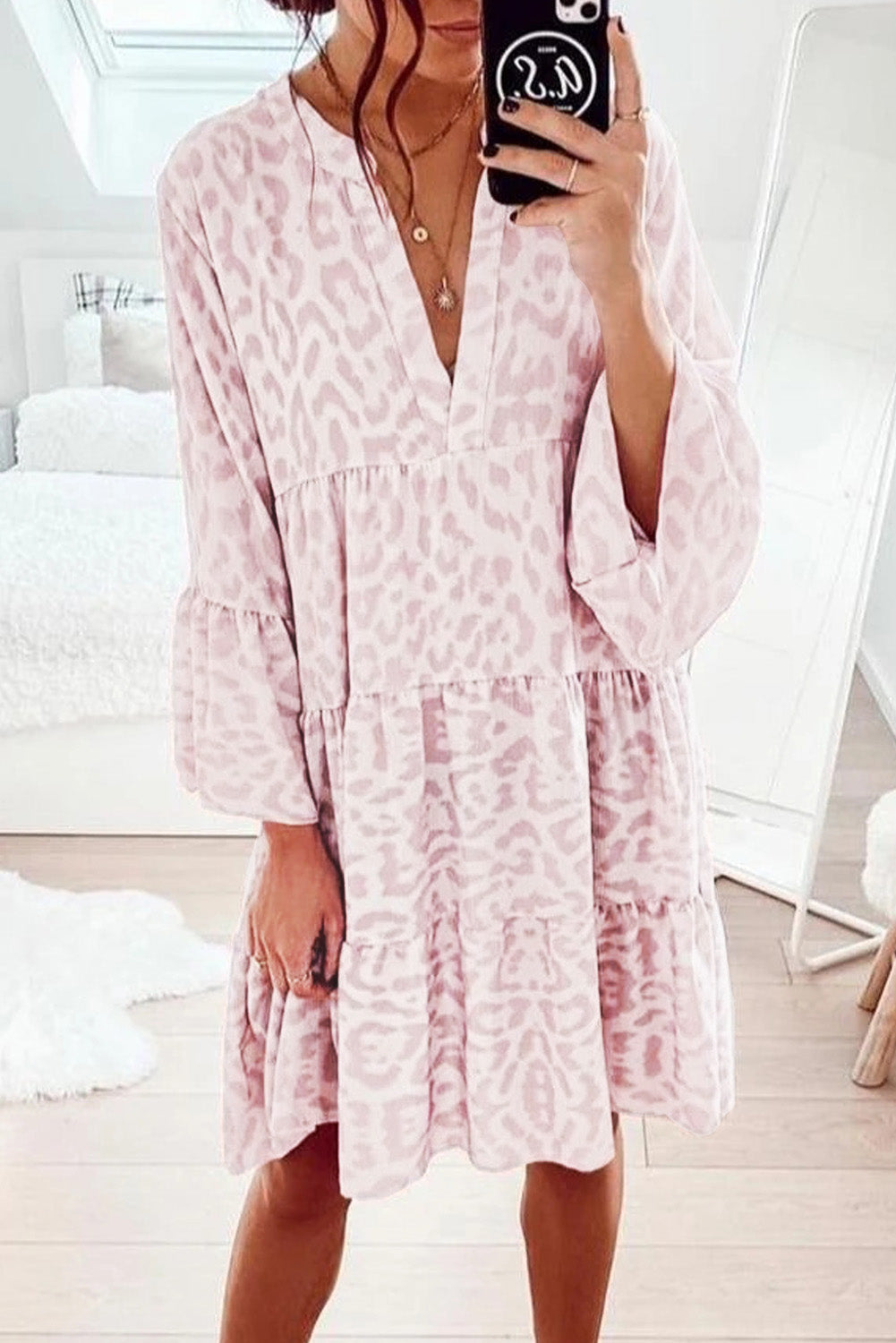 A stylish Pink Leopard Print V Neck Ruffle Swing Mini Dress featuring a deep V neckline and ruffle details, perfect for casual and formal occasions.