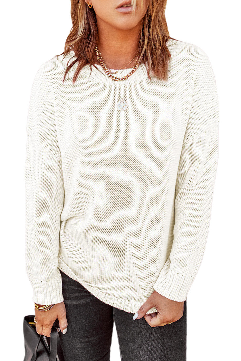 A stylish pink oversize knitted sweater with drop-shoulder sleeves, perfect for winter wear.