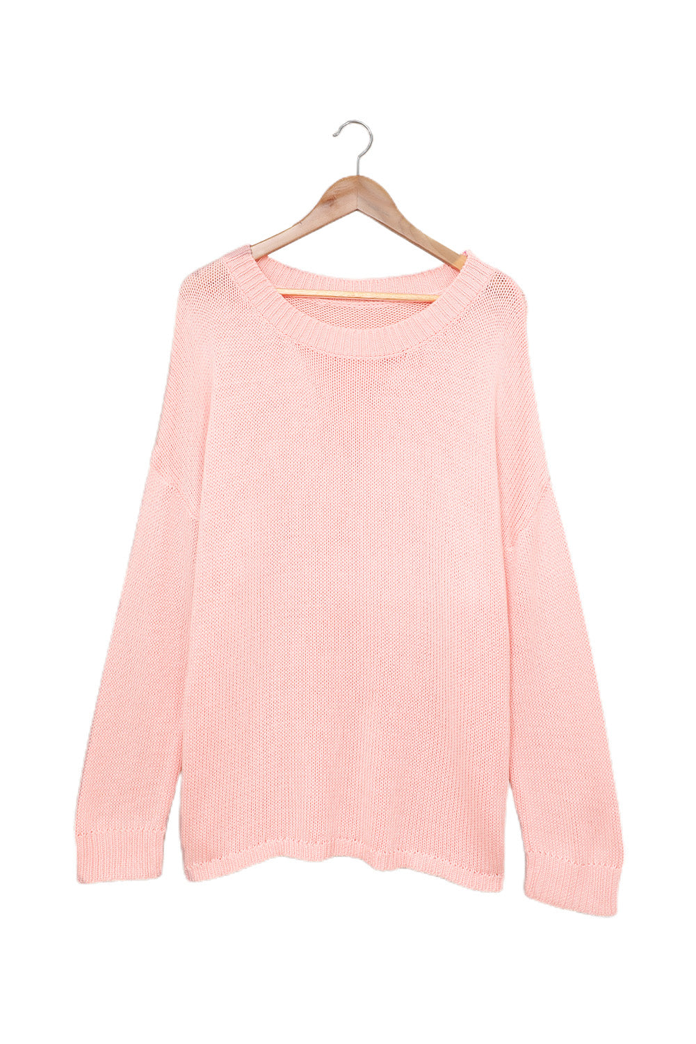 A stylish pink oversize knitted sweater with drop-shoulder sleeves, perfect for winter wear.