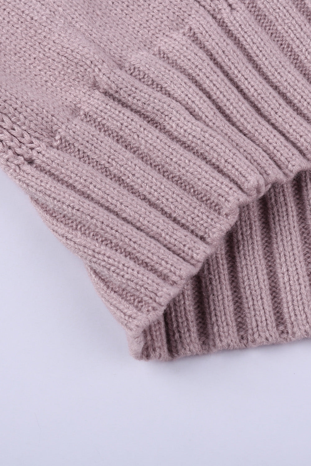 A cozy pink oversize thick pullover sweater with a cable knit design, perfect for winter wear.