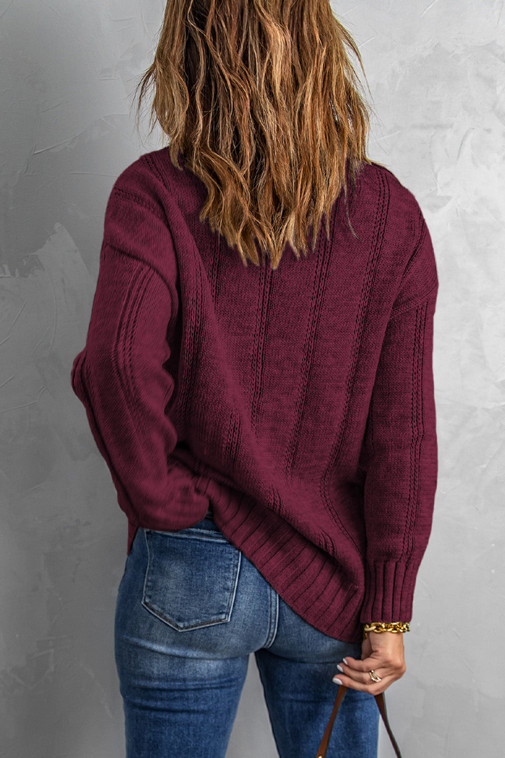 A cozy pink oversize thick pullover sweater with a cable knit design, perfect for winter wear.